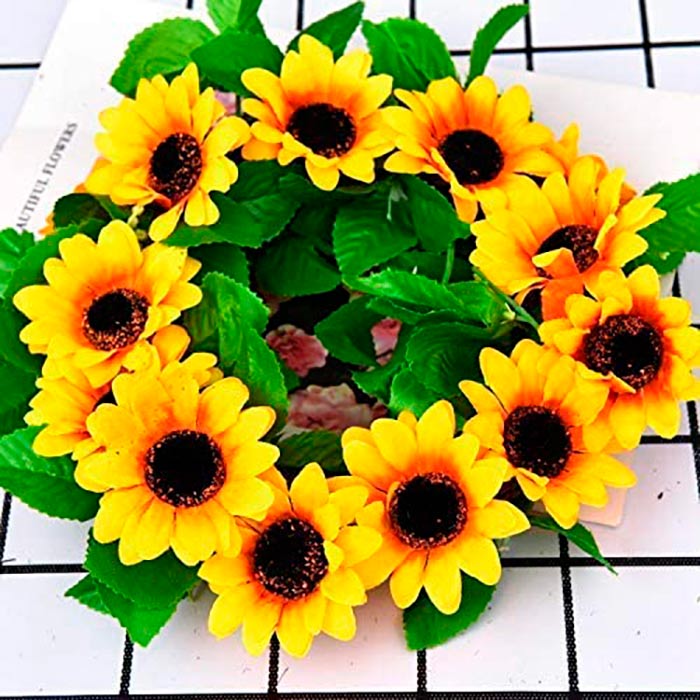 The artificial garland has green leaves and 12 sunflowers that look like real ones!