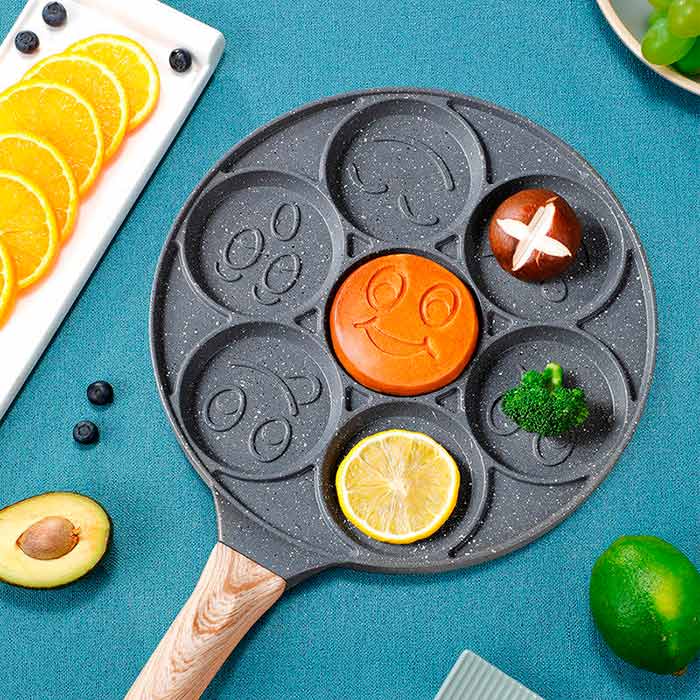 Specially shaped smiley-shaped recesses for cooking 7 pancakes at once!