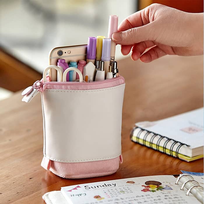 Pull-out design: transforms from securely closed to standing holder